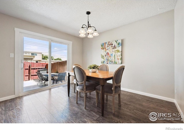 1119 Milky Way, Thornton, CO 80260 - dining area featuring a chandelier, wood finished floors, and a textured ceiling