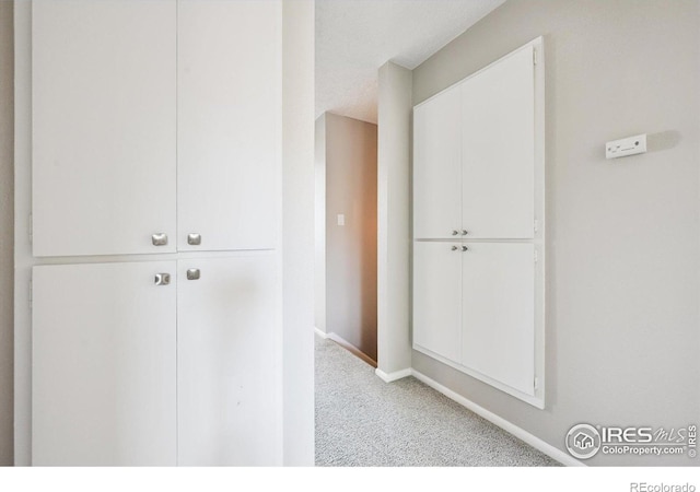 1119 Milky Way, Thornton, CO 80260 - corridor featuring carpet floors and baseboards