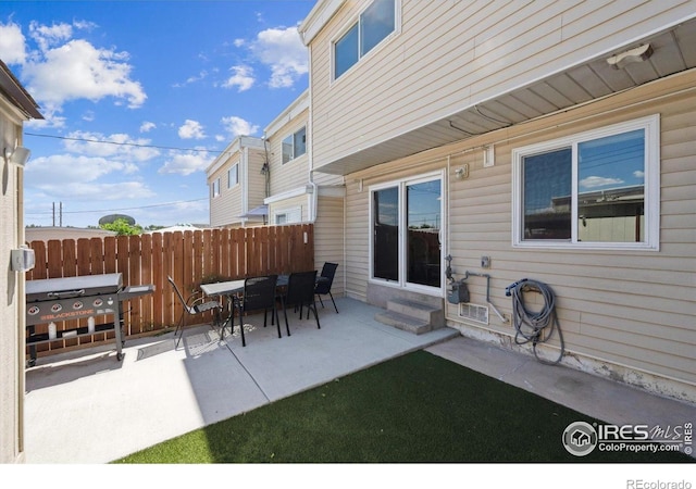 1119 Milky Way, Thornton, CO 80260 - view of patio with entry steps and grilling area