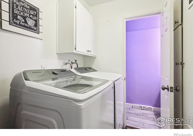 1119 Milky Way, Thornton, CO 80260 - laundry area featuring washing machine and clothes dryer and cabinet space