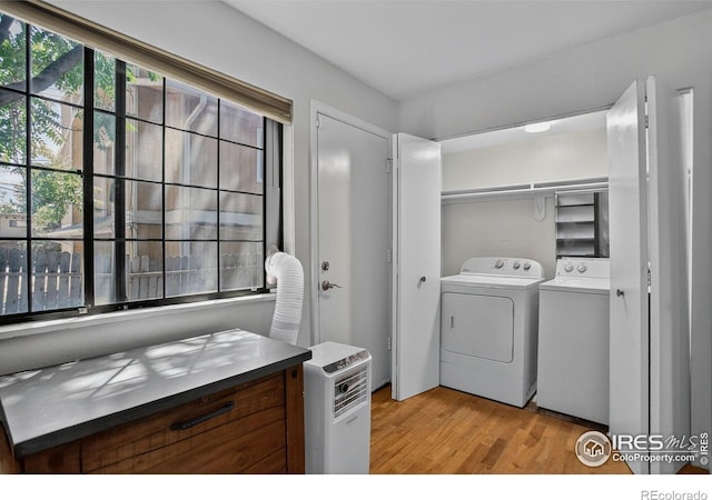 2279 Spruce St Unit 8, Boulder, CO 80302 - laundry room with washing machine and clothes dryer and light wood-style floors