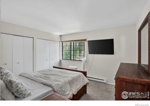 2279 Spruce St Unit 8, Boulder, CO 80302 - carpeted bedroom with baseboard heating and two closets