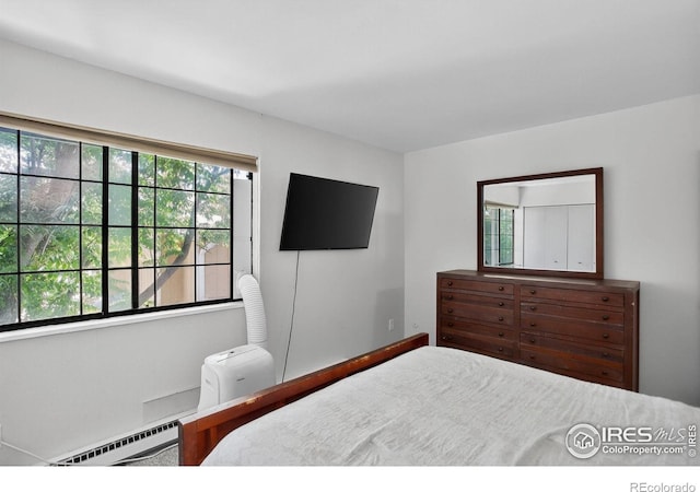 2279 Spruce St Unit 8, Boulder, CO 80302 - bedroom featuring a baseboard radiator and baseboards