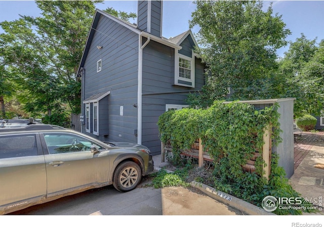 2279 Spruce St Unit 8, Boulder, CO 80302 - view of home's exterior featuring a chimney