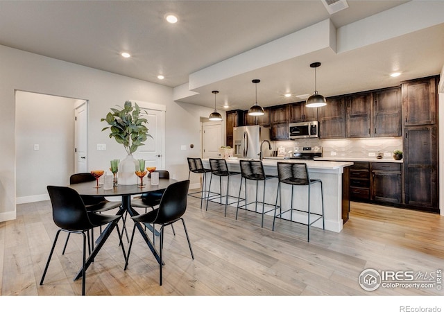 265 High Point Dr Unit 202, Longmont, CO 80504 - dining room with light wood-style flooring and recessed lighting