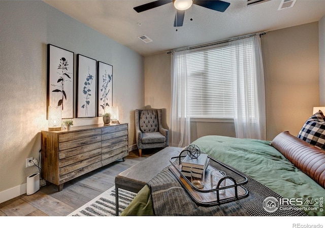 265 High Point Dr Unit 202, Longmont, CO 80504 - bedroom featuring light wood-style flooring and a ceiling fan