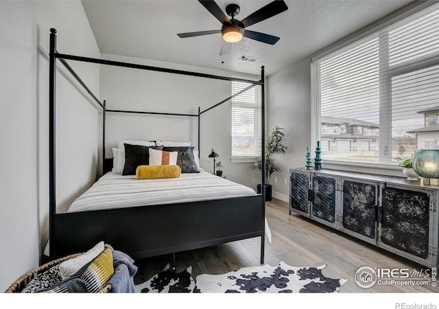 265 High Point Dr Unit 202, Longmont, CO 80504 - bedroom featuring wood finished floors and a ceiling fan