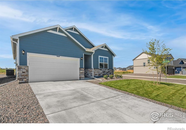 4808 Lynxes Way, Johnstown, CO 80534 - craftsman inspired home featuring stone siding, an attached garage, driveway, and a front yard