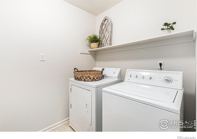 5124 Stillwater Creek Dr Unit E, Fort Collins, CO 80528 - laundry area with independent washer and dryer and light tile patterned flooring