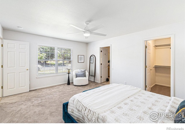 5124 Stillwater Creek Dr Unit E, Fort Collins, CO 80528 - carpeted bedroom with ceiling fan and a walk in closet