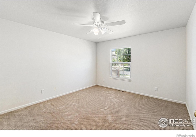 5124 Stillwater Creek Dr Unit E, Fort Collins, CO 80528 - carpeted empty room featuring a ceiling fan and baseboards