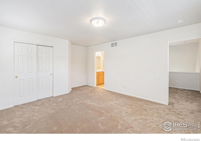 5124 Stillwater Creek Dr Unit E, Fort Collins, CO 80528 - unfurnished bedroom featuring light carpet, a closet, and ensuite bath
