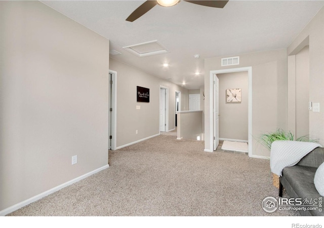 6818 Whisper Trail Ln, Wellington, CO 80549 - unfurnished room featuring attic access, a ceiling fan, and carpet floors