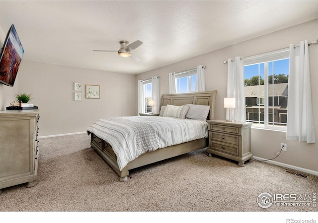 6818 Whisper Trail Ln, Wellington, CO 80549 - bedroom with light colored carpet and ceiling fan