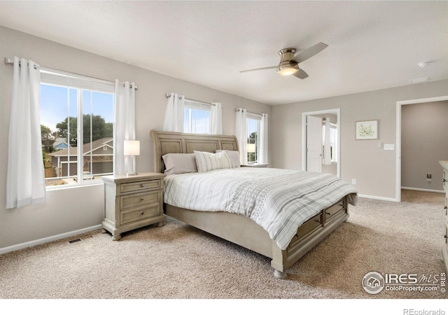 6818 Whisper Trail Ln, Wellington, CO 80549 - bedroom featuring light colored carpet and a ceiling fan