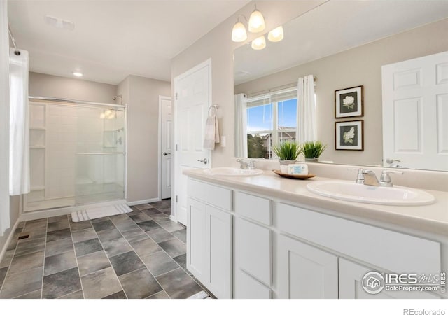 6818 Whisper Trail Ln, Wellington, CO 80549 - bathroom with double vanity and a stall shower