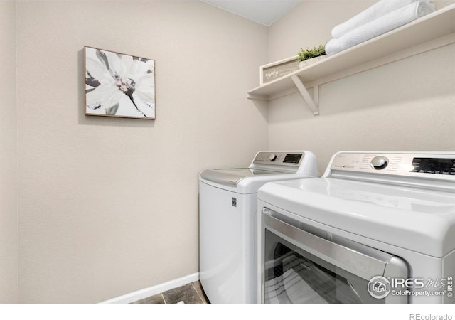 6818 Whisper Trail Ln, Wellington, CO 80549 - laundry area with washer and clothes dryer and baseboards