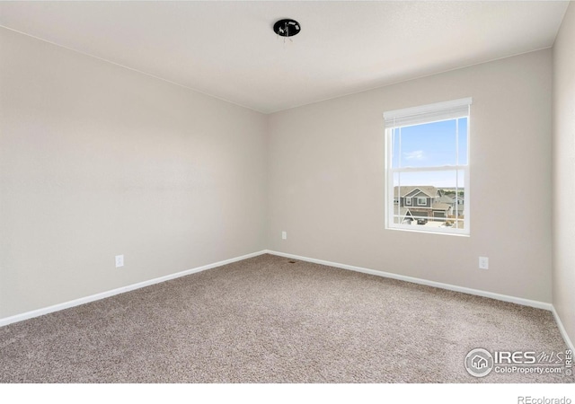 6818 Whisper Trail Ln, Wellington, CO 80549 - spare room featuring carpet flooring and baseboards