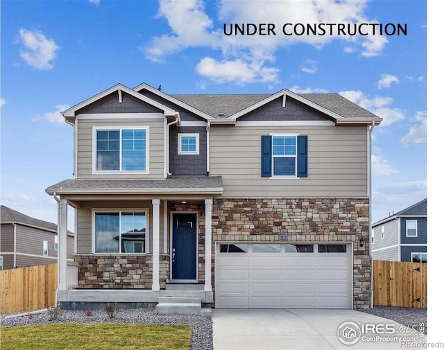 6537 14th St, Frederick, CO 80530 - craftsman-style home with stone siding, an attached garage, a porch, concrete driveway, and roof with shingles
