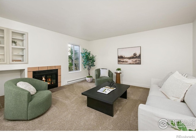 3465 Lochwood Dr Unit N-61, Fort Collins, CO 80525 - carpeted living area with a baseboard heating unit, a tile fireplace, and built in shelves