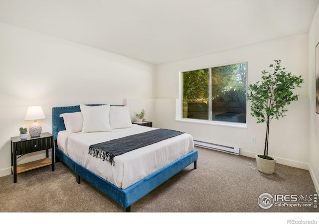 3465 Lochwood Dr Unit N-61, Fort Collins, CO 80525 - carpeted bedroom featuring a baseboard heating unit and baseboards