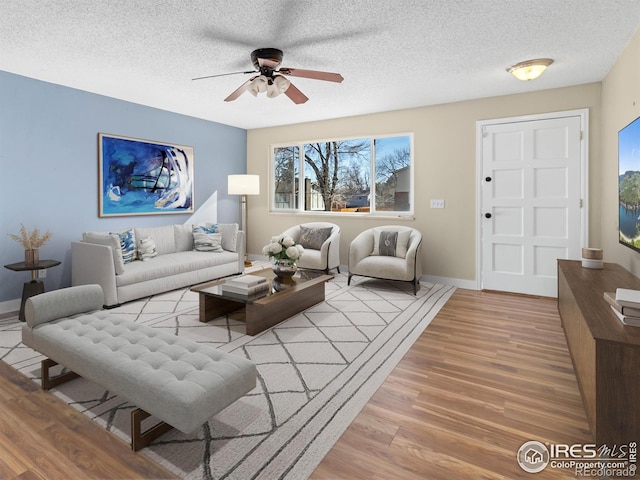 18931 E Brunswick Pl, Aurora, CO 80013 - living area with a ceiling fan, wood finished floors, and a textured ceiling