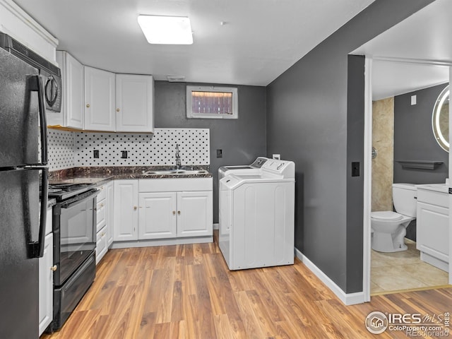 18931 E Brunswick Pl, Aurora, CO 80013 - laundry room with washing machine and clothes dryer and light wood-style flooring