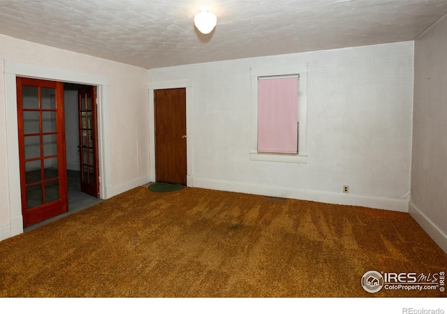 19089 Chambers Dr, Sterling, CO 80751 - spare room with carpet floors and a textured ceiling