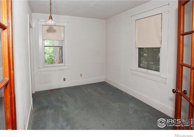 19089 Chambers Dr, Sterling, CO 80751 - unfurnished room with dark carpet and baseboards