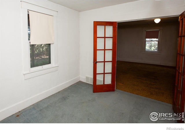 19089 Chambers Dr, Sterling, CO 80751 - carpeted spare room featuring baseboards and french doors