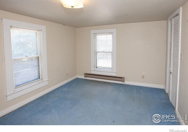 19089 Chambers Dr, Sterling, CO 80751 - carpeted empty room with baseboard heating and baseboards