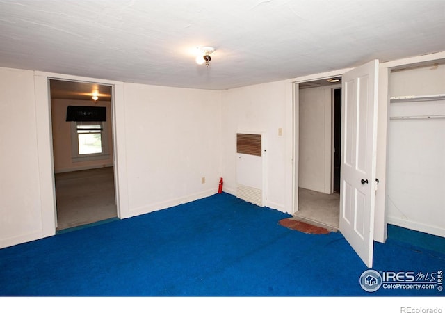 19089 Chambers Dr, Sterling, CO 80751 - below grade area with a heating unit and carpet floors