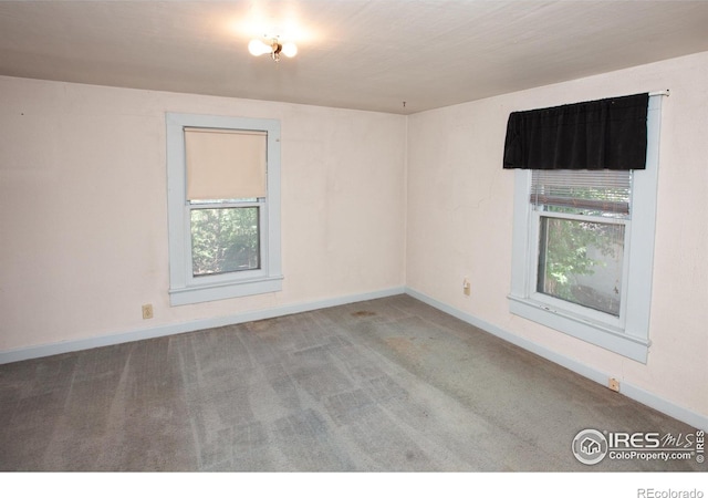 19089 Chambers Dr, Sterling, CO 80751 - spare room with plenty of natural light and carpet
