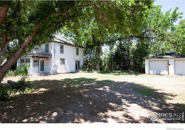 19089 Chambers Dr, Sterling, CO 80751 - view of yard featuring an outbuilding and a detached garage