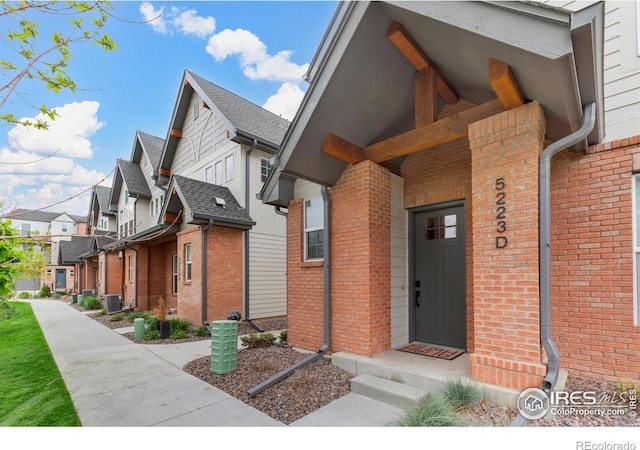 5223 Allison Way Unit D, Arvada, CO 80002 - view of side of property featuring a residential view and brick siding