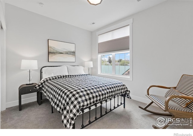 5223 Allison Way Unit D, Arvada, CO 80002 - carpeted bedroom with baseboards and a water view