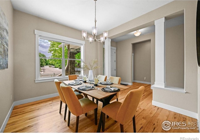3031 Thunder Lake Cir, Lafayette, CO 80026 - dining room featuring a chandelier and light wood-style flooring