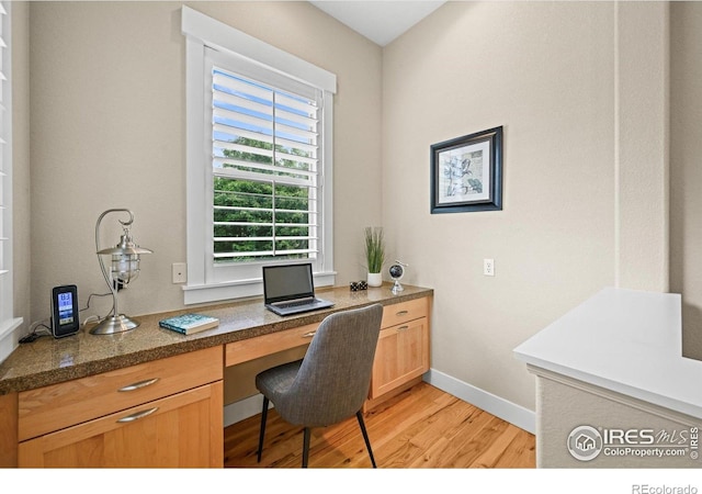 3031 Thunder Lake Cir, Lafayette, CO 80026 - home office with light wood finished floors and built in desk