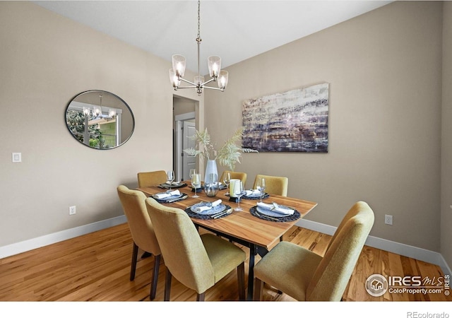 3031 Thunder Lake Cir, Lafayette, CO 80026 - dining space with a chandelier and light wood-type flooring