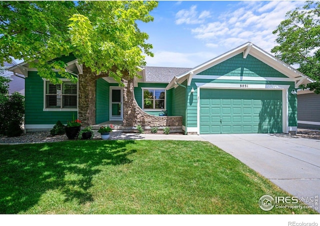 3031 Thunder Lake Cir, Lafayette, CO 80026 - view of front facade with an attached garage, concrete driveway, and a front yard