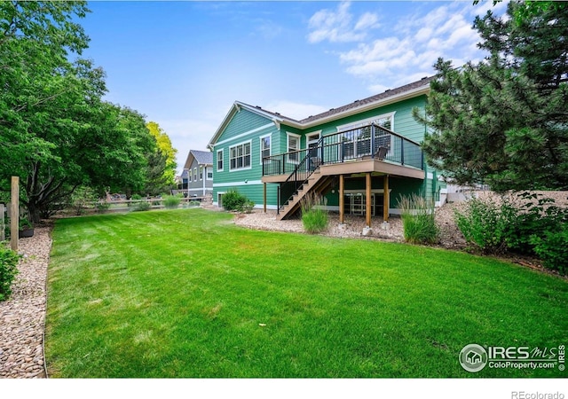3031 Thunder Lake Cir, Lafayette, CO 80026 - back of property with stairway and a wooden deck