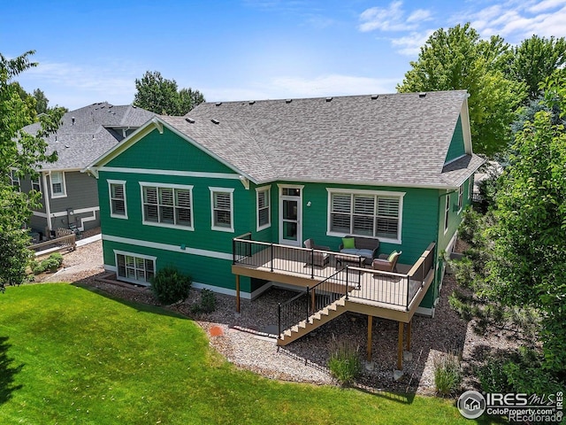 3031 Thunder Lake Cir, Lafayette, CO 80026 - back of property with roof with shingles, a deck, and a lawn