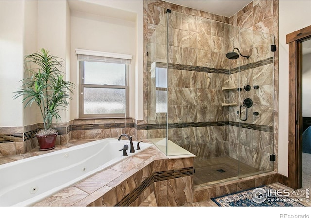 973 Skipping Stone Ct, Timnath, CO 80547 - bathroom with a tub with jets and a shower stall