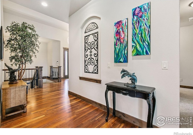 973 Skipping Stone Ct, Timnath, CO 80547 - corridor with an upstairs landing and wood finished floors