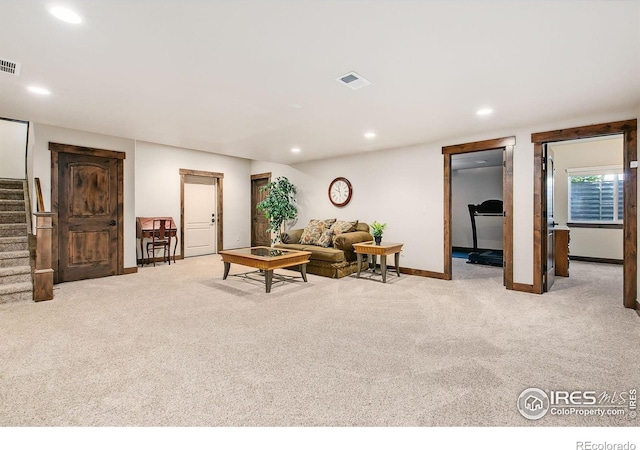 973 Skipping Stone Ct, Timnath, CO 80547 - living room featuring carpet flooring, stairs, and recessed lighting