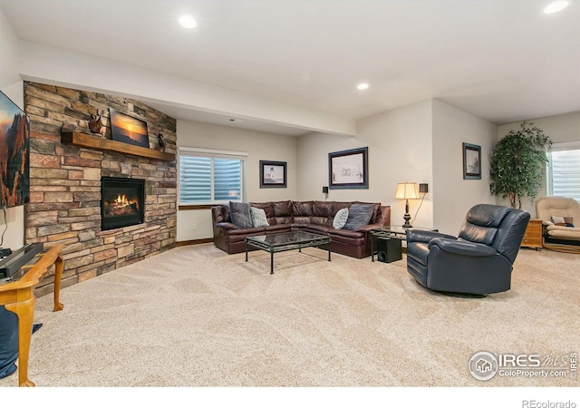 973 Skipping Stone Ct, Timnath, CO 80547 - carpeted living room with a fireplace and recessed lighting