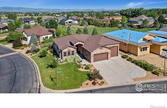 973 Skipping Stone Ct, Timnath, CO 80547 - aerial view of residential area featuring a mountainous background
