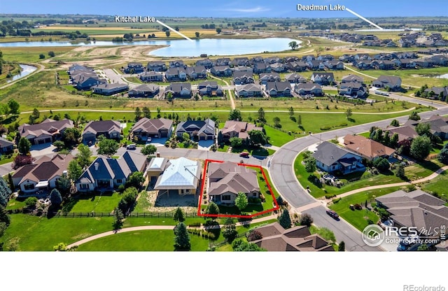 973 Skipping Stone Ct, Timnath, CO 80547 - aerial perspective of suburban area with property boundaries highlighted and a large body of water