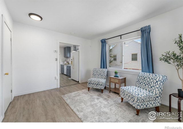 114 Berwick Ave, Firestone, CO 80520 - living area featuring light wood finished floors and baseboards