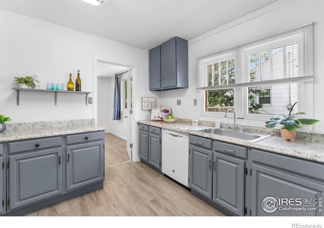 114 Berwick Ave, Firestone, CO 80520 - kitchen with white dishwasher, light wood-style flooring, gray cabinets, and light countertops
